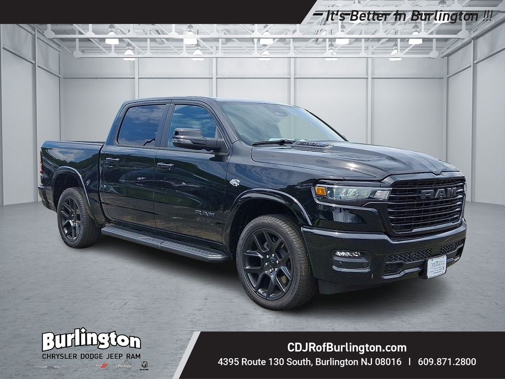 2026 RAM Ram 1500 RAM 1500 LARAMIE CREW CAB 4X4 5'7' BOX in Diamond Black Crystal Pearl-Coat Exterior Paint — front three-quarter view