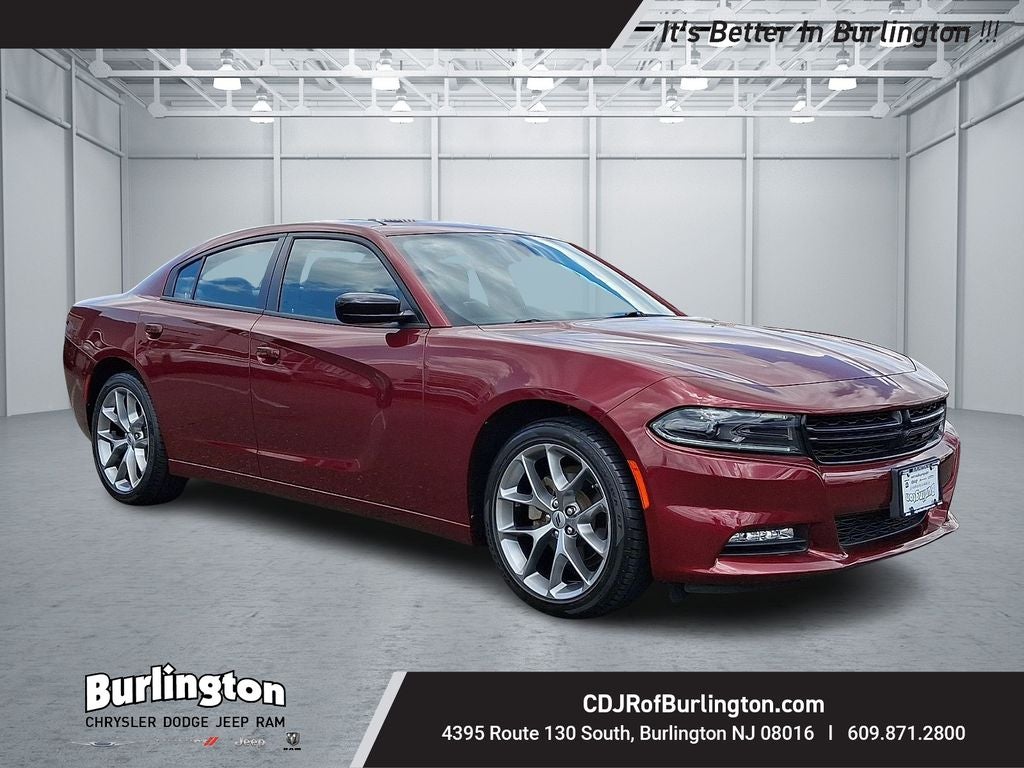 2023 Dodge Charger SXT in Octane Red Pearlcoat — front three-quarter view